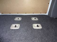 floor mounts for back seat with trim and carpet.